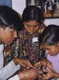 people learning to use a tape recorder, India
